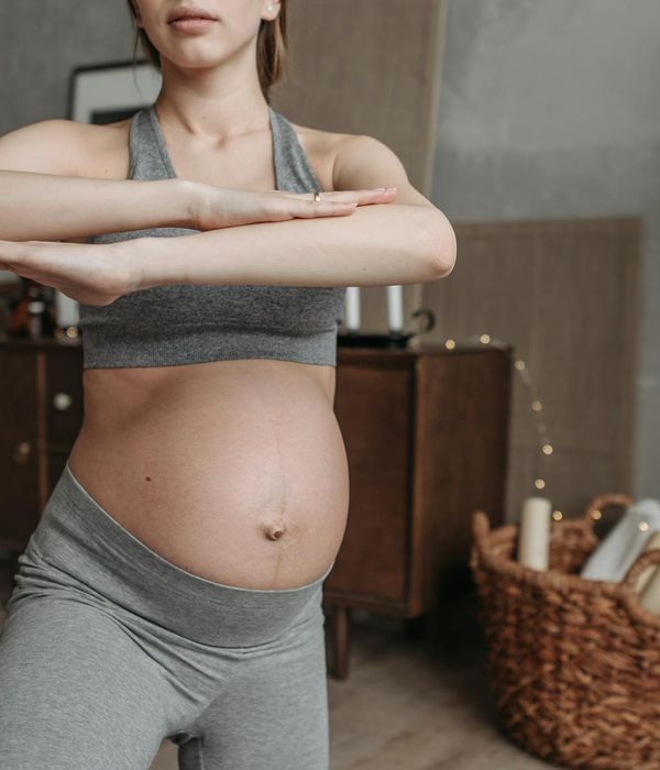 Man in a calm, focused state during a flexibility exercise.
